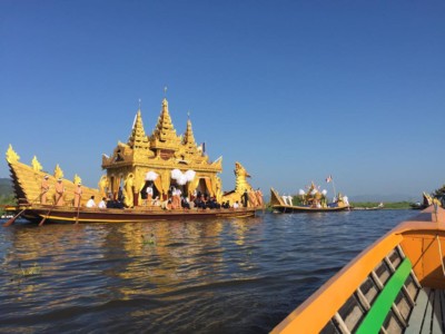 The Karaweik barge carrying 4 images of Buddha during the Phaung Daw Oo Pagoda Festival in Inle Lake, Myanmar. Myanmar festivals.
