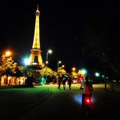 My niece + a Velib bike + her 1st view of the Eiffel Tower at night