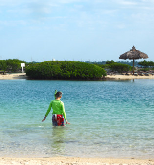 Hawks Cay Resort child snorkel in the lagoon