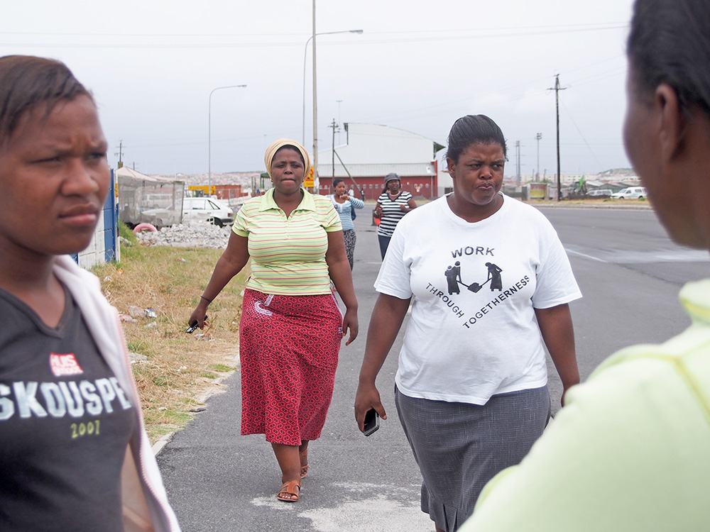 Participants walk back to the van after a day of photographing Township Life for the postcard image.