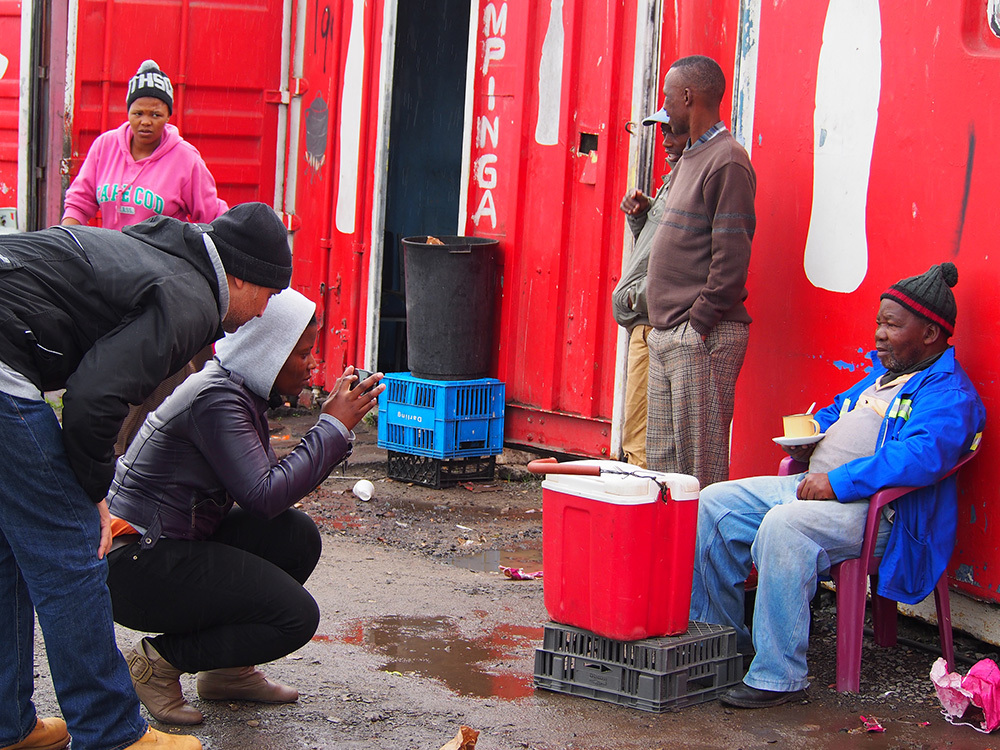 Nwabisa Ndongeni a mother of 2, photographs Henry at the Site C taxi rank in Khayelitsha as Thoban Joppie, a member of the Cape Town Instagram community offers some tips. On June 1, 2014, the women hosted the inaugural #InstameetEKASI in Khayelitsha with members of the Cape Town Igers (instagrammers). It was wonderful to see these two communities come together in their mutual love of mobile photography and Instagram. The ladies enjoyed their time, appreciated the tips and look forward to another InstameetEKASI.