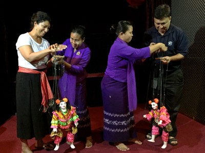 My cousin and father trying their hand at puppetry at the Htwe Oo Myanmar puppet show in Yangon, Myanmar.